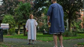 Anna (Katherine Parkinson) in a hospital gown stood opposite Sam (Youssef Kerkour) in Significant Other