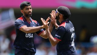 Saurabh Netravalkar of USA celebrates taking a wicket with his teammate at the T20 World Cup 2024