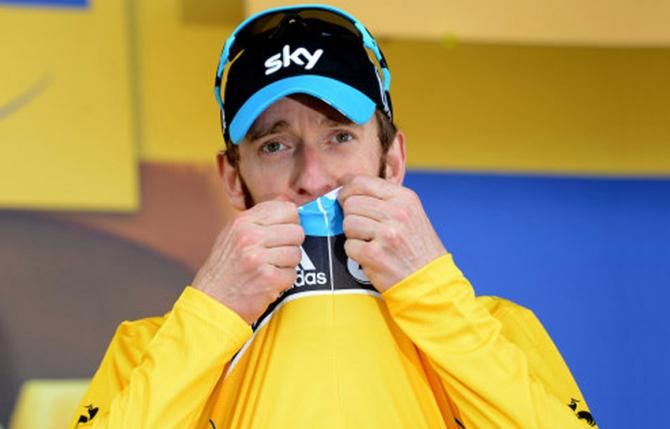 Bradley Wiggins kisses his yellow jersey after winning the individual time trial and effectively securing the Tour de France 2012 overall title.