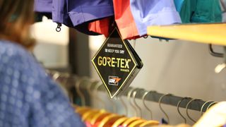 A Gore-tex label hanging from clothing in an outdoor store