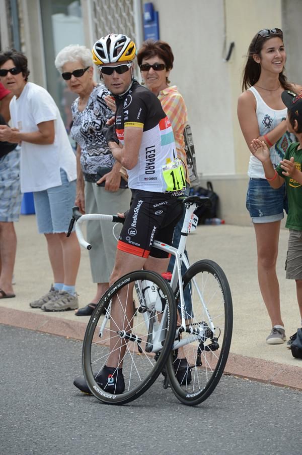 Chris Horner waits for assistance