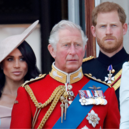 Meghan, Duchess of Sussex, Prince Charles, Prince of Wales and Prince Harry, Duke of Sussex stand on the balcony of Buckingham Palace during Trooping The Colour 2018 on June 9, 2018 in London, England.