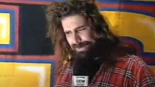 Cactus Jack giving his "Cane Dewey" promo