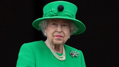 Queen Elizabeth II stands on the balcony at Buckingham Palace at the end of the Platinum Pageant on The Mall on June 5, 2022 in London, England. The Platinum Jubilee of Elizabeth II is being celebrated from June 2 to June 5, 2022, in the UK and Commonwealth to mark the 70th anniversary of the accession of Queen Elizabeth II on 6 February 1952. 