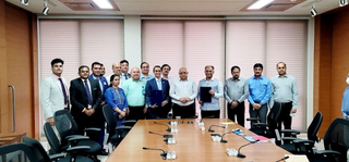 Triton officials with the Gujarat government officials, including its CM, at the MoU signing function