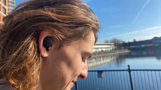 Sony WF-1000XM4 workout earbuds in a person's ear