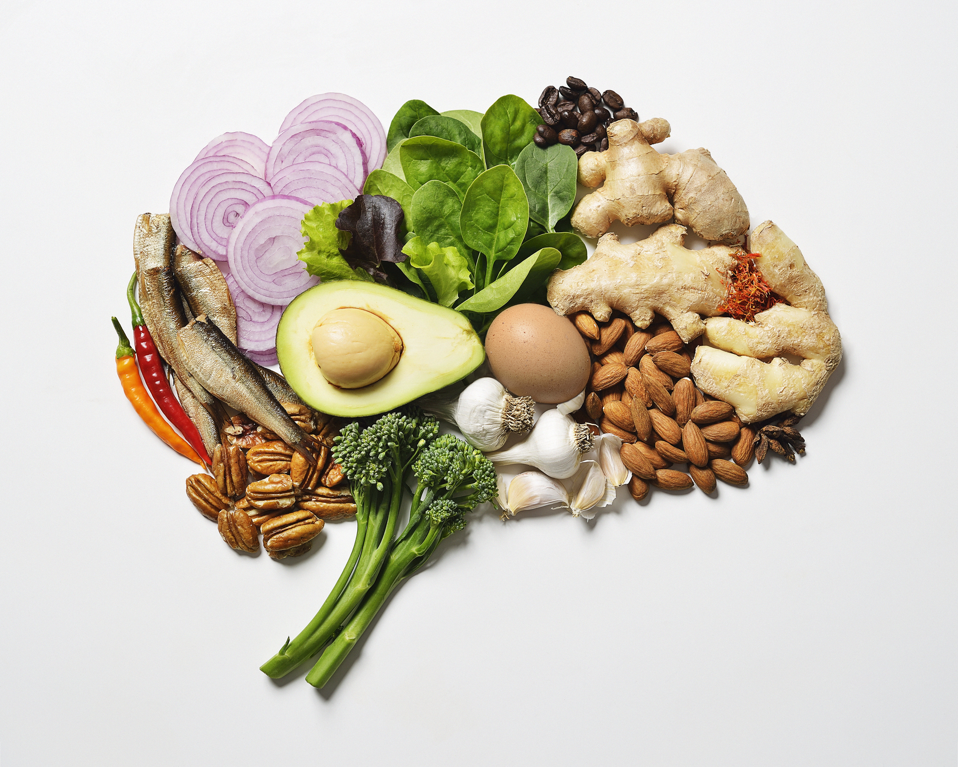 Healthy foods arranged in a tableu resembling the shape of a brain.