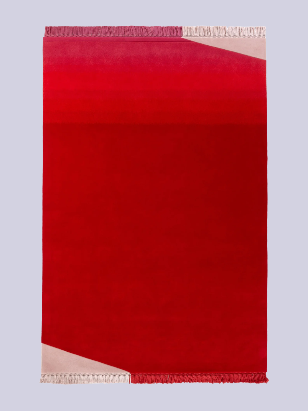 A bright red rug from Tai Ping with a fringe hem