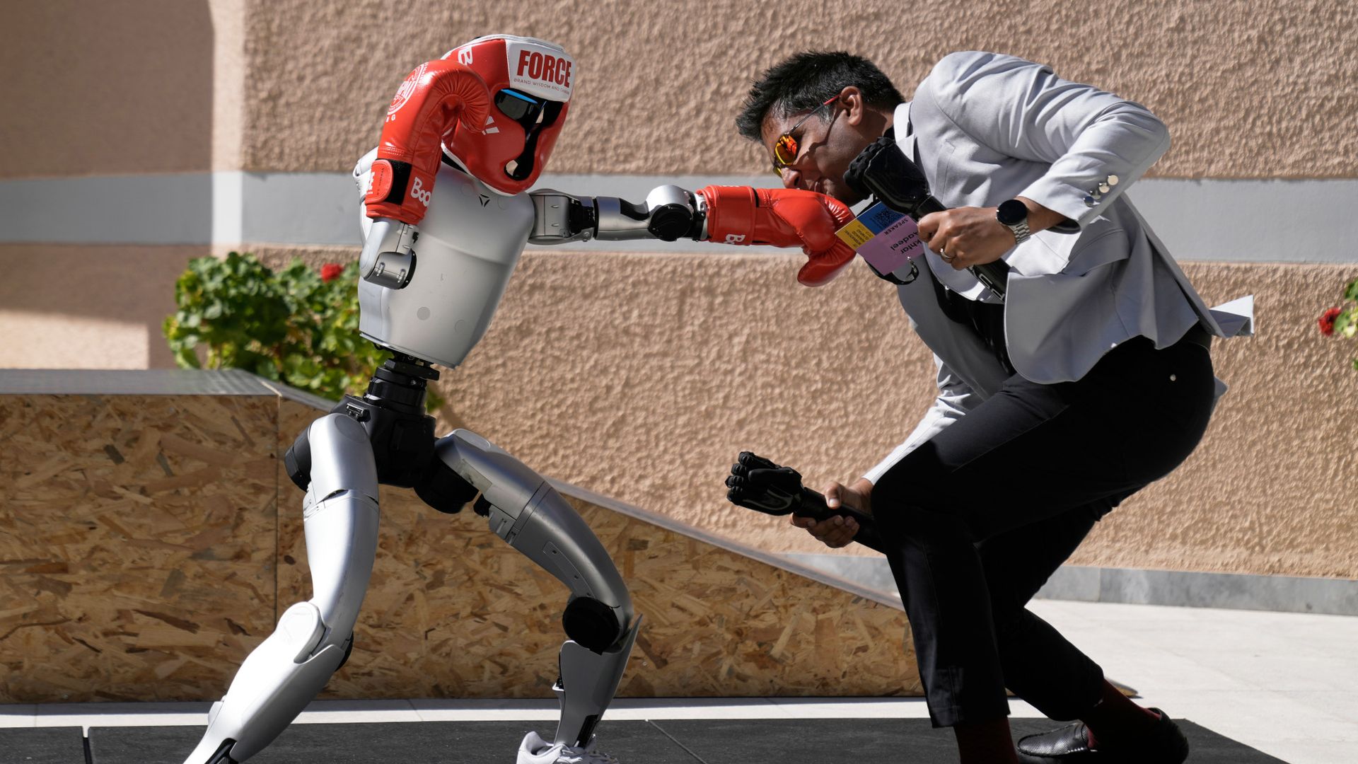 
                                A robot boxes against the CEO of bionics company Psyonic in Olympia, Greece
                            