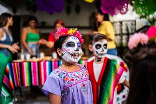 Two children with Day of the Dead face paint