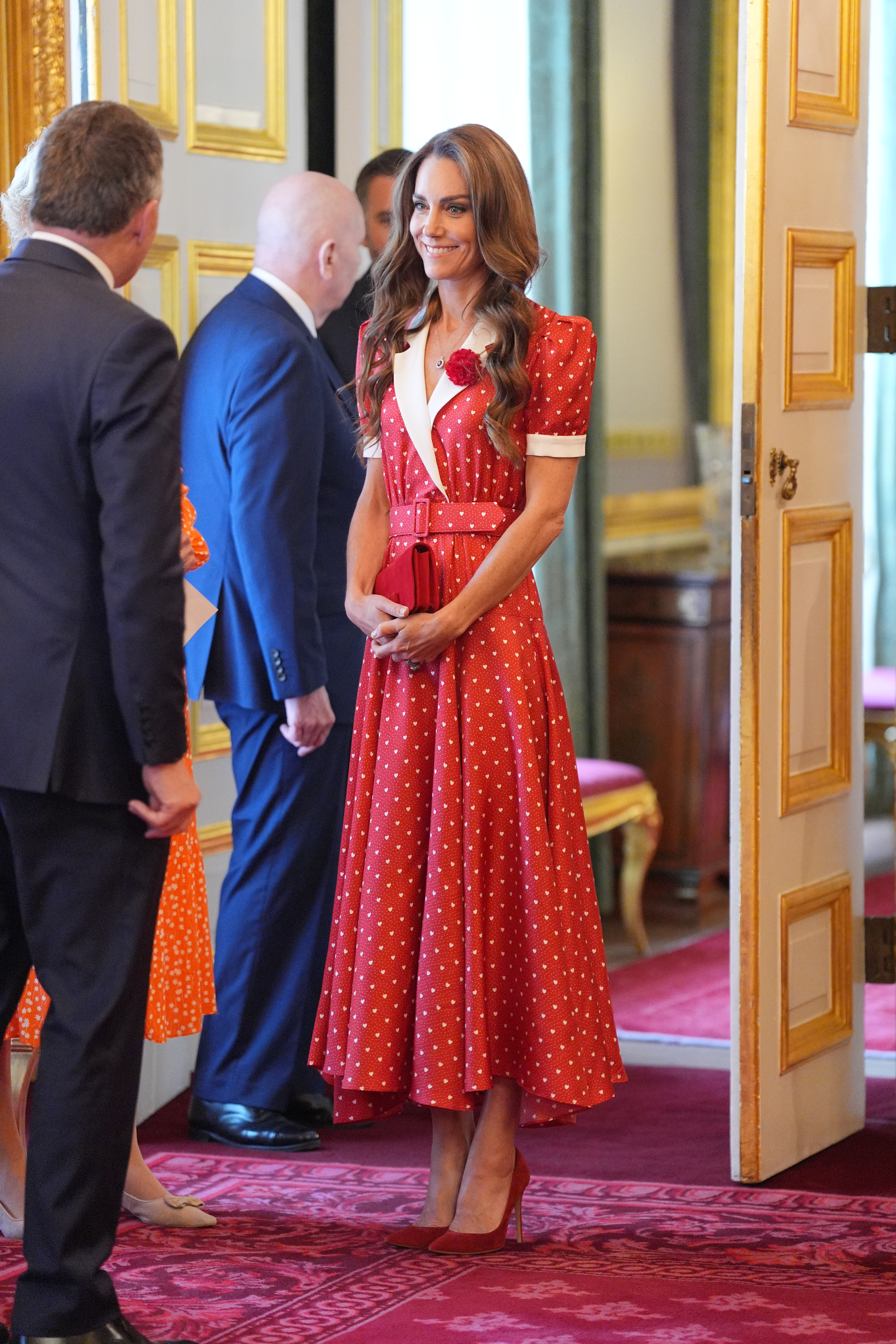 Princess Kate wearing a red dress