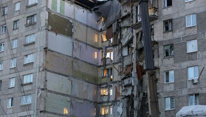 A baby boy has been rescued from this collapsed apartment block in Russia