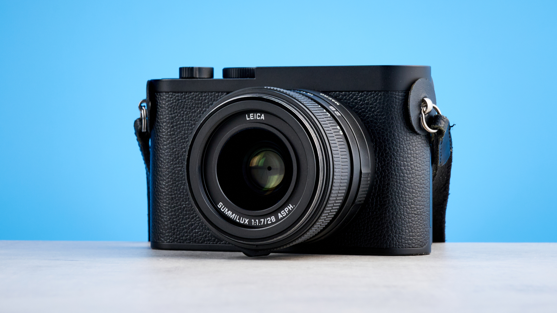 A black Leica Q3 Monochrom black-and-white mirrorless camera