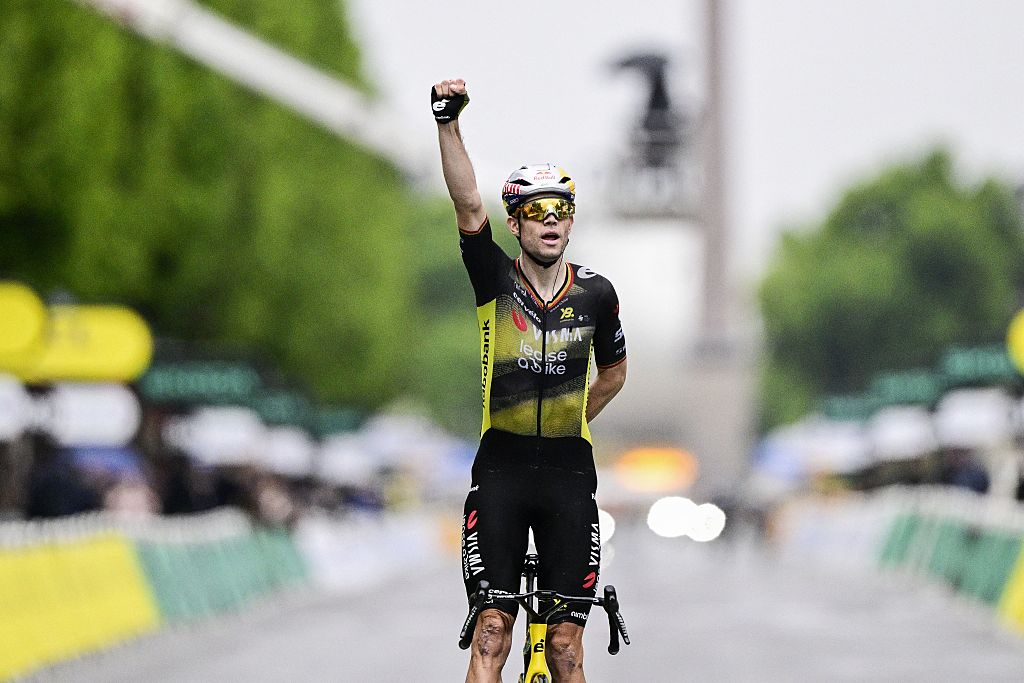 Belgian Wout van Aert of Team Visma-Lease a Bike celebrates as he crosses the finish line to win stage 21 of the 2025 Tour de France cycling race, from Mantes-la-Ville to Paris (120km), on Sunday 27 July 2025 in France. The 112th edition of the Tour de France starts on Saturday 5 July in Lille, France, and will finish in Paris, France on the 27th of July. BELGA PHOTO DIRK WAEM (Photo by DIRK WAEM / BELGA MAG / Belga via AFP)