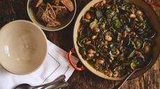 clams, butter beans and jamon in a pot