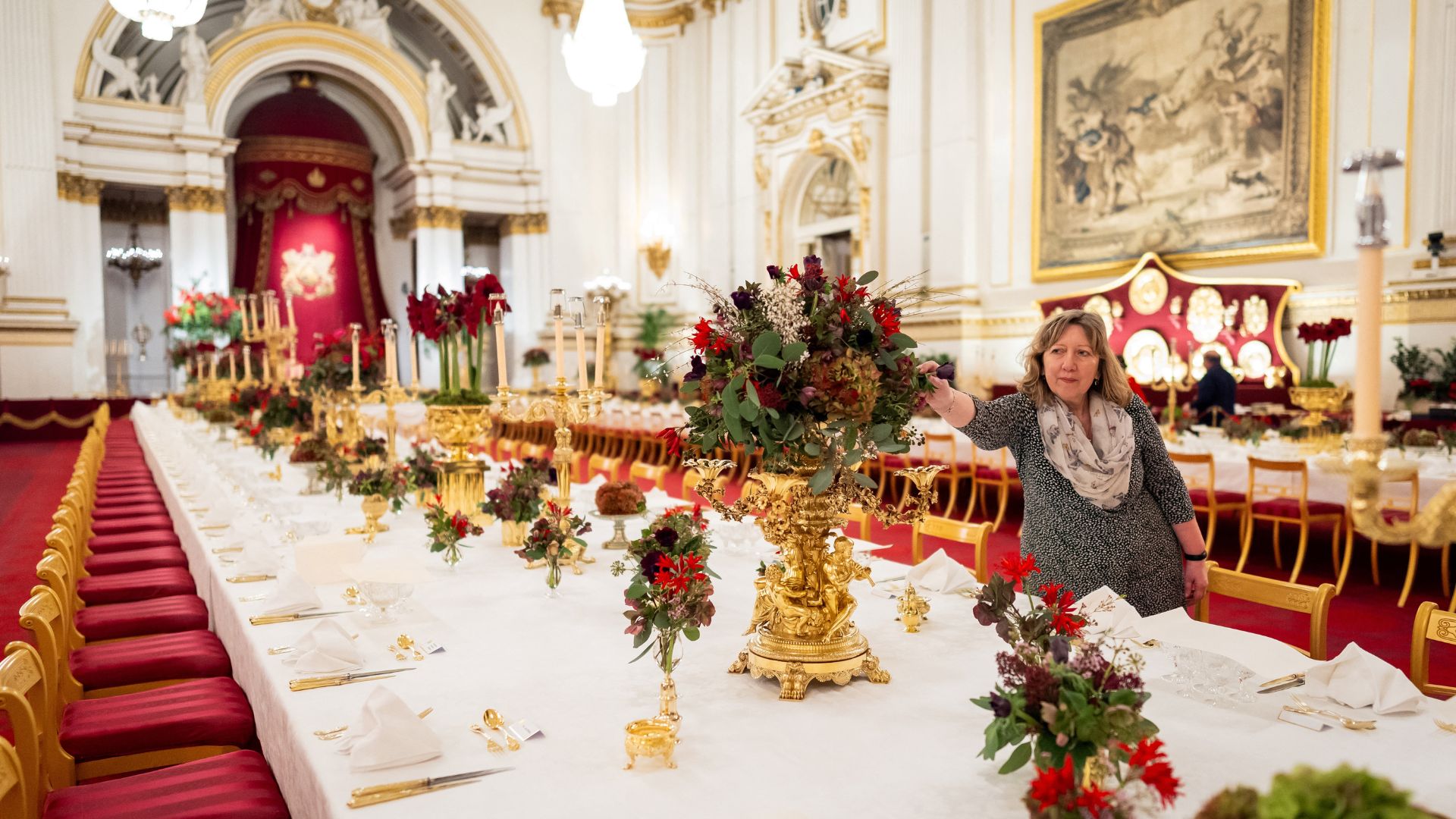 A botanist tends to flowers before a state banquet at Buckingham Palace