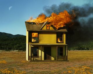 Photograph of burning yellow house