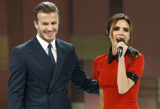 David and Victoria Beckham on stage in China