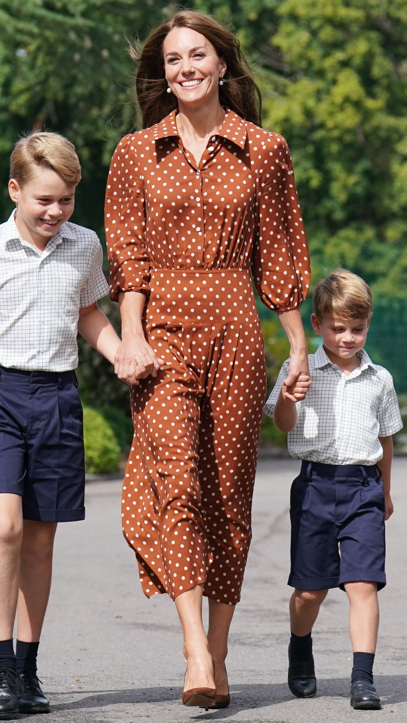 Kate Middleton holds Prince George and Louis's hands as they arrive for a settling in afternoon at Lambrook School, near Ascot in Berkshire on September 7, 2022