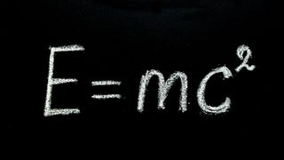 Special relativity equation (E=mc^2) on a chalkboard. 