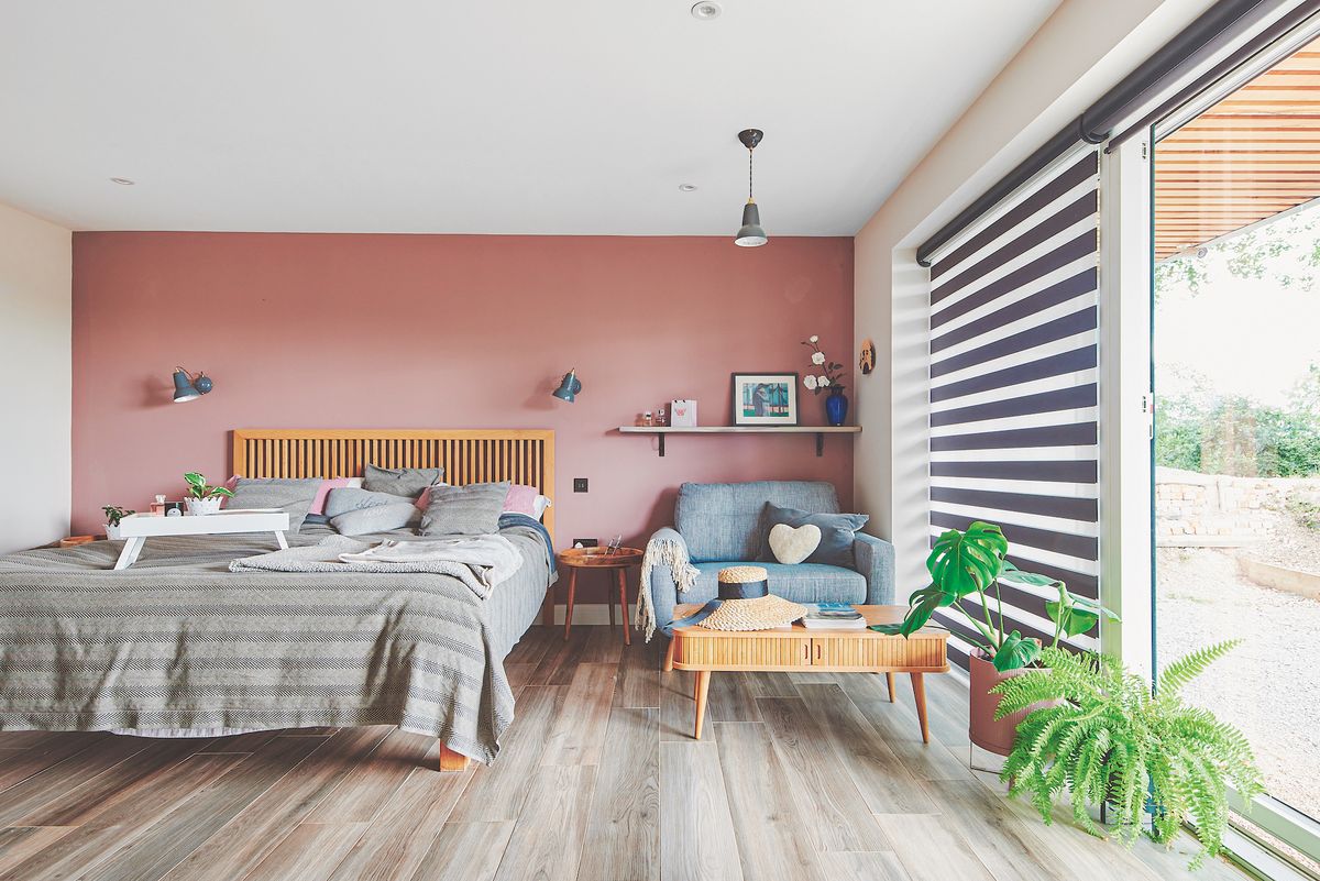pink bedroom in self build with large windows