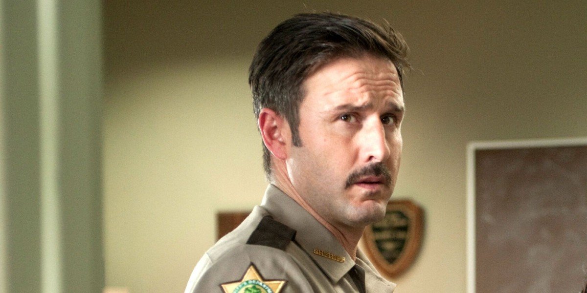 Scream 4 David Arquette looks to the camera worried