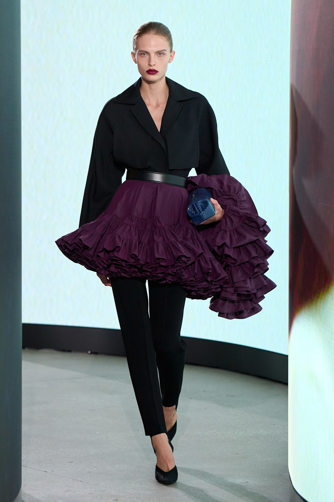 A model walking in the spring/summer 2027 Ala&amp;iuml;a show during Paris Fashion Week wearing a jewel-tone look.