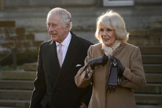 King Charles III and Camilla, Queen Consort leave Bolton Town Hall during a tour of Greater Manchester on January 20, 2023 in Bolton, United Kingdom.