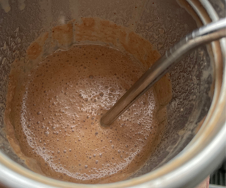 A frothy, coffee shake in the nutribullet Flip™ Insulated Portable Blender