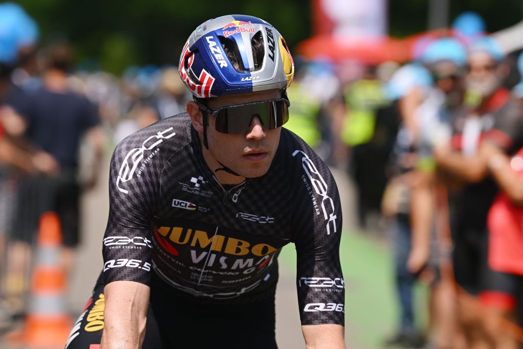 TBACH SWITZERLAND JUNE 17 Wout Van Aert of Belgium and Team JumboVisma Black Points Jersey wearing a black ribbon in memory of Gino Mder prior to the 86th Tour de Suisse 2023 Stage 7 a 1835km stage from Tbach to Weinfelden UCIWT on June 17 2023 in Tbach Switzerland Photo by Dario BelingheriGetty Images