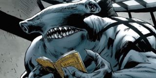 DC supervillain King Shark reads a book in prison