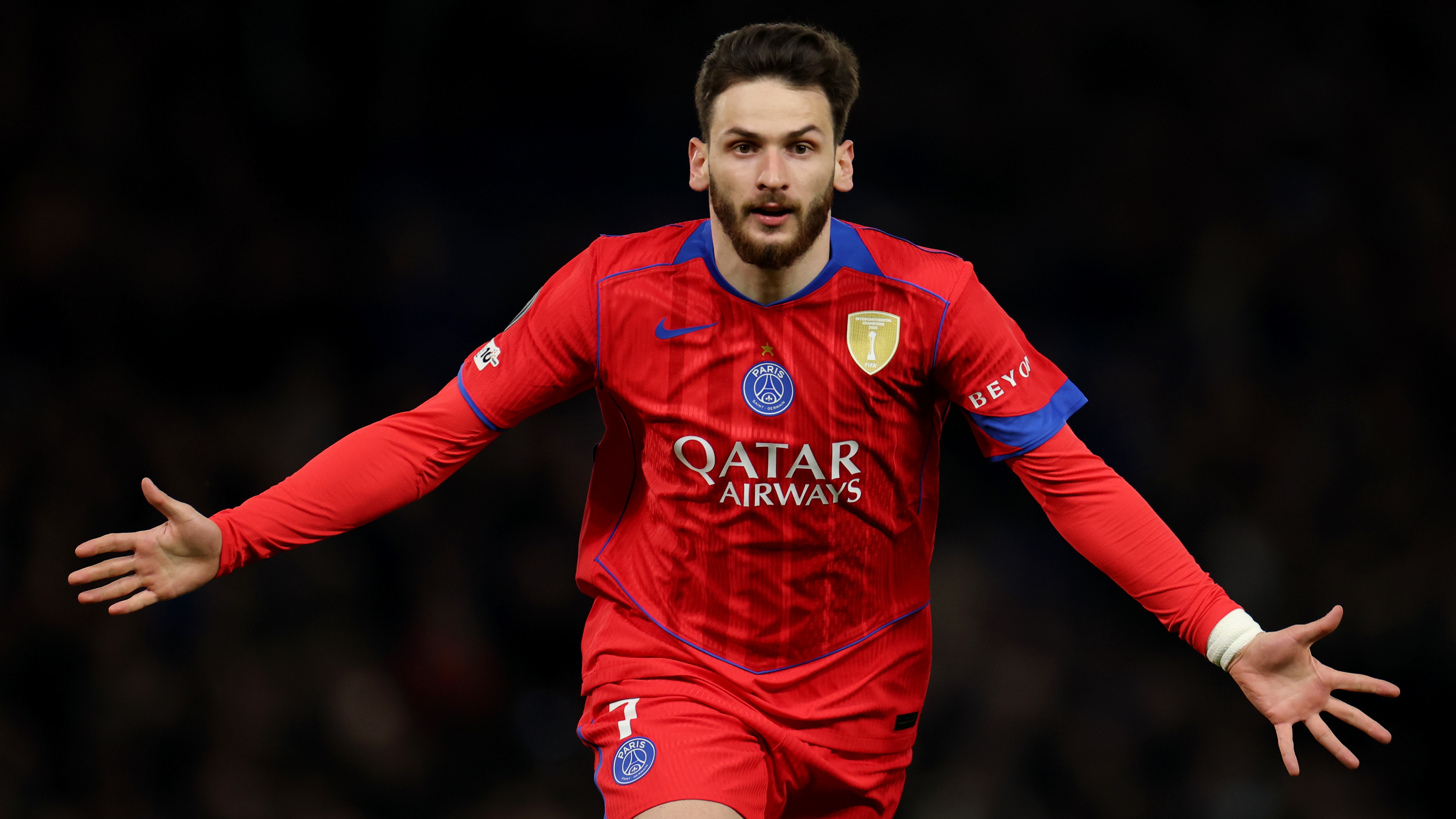 : Khvicha Kvaratskhelia of Paris Saint-Germain celebrates scoring his team's first goal during the UEFA Champions League 2025/26 Round of 16 Second Leg match between Chelsea FC and Paris Saint-Germain FC at Stamford Bridge on March 17, 2026 in London, England.