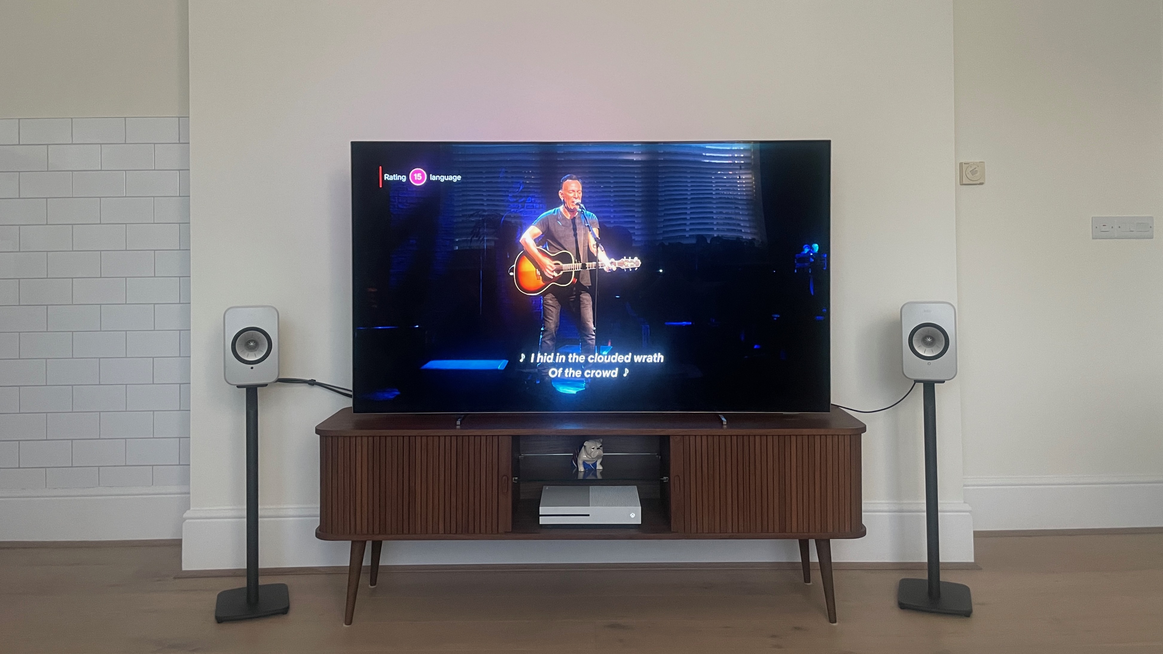 KEF LSX II speakers connected to TV playing live concerts