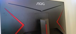 An AOC Gaming C27G2AE curved gaming monitor sitting on a desk