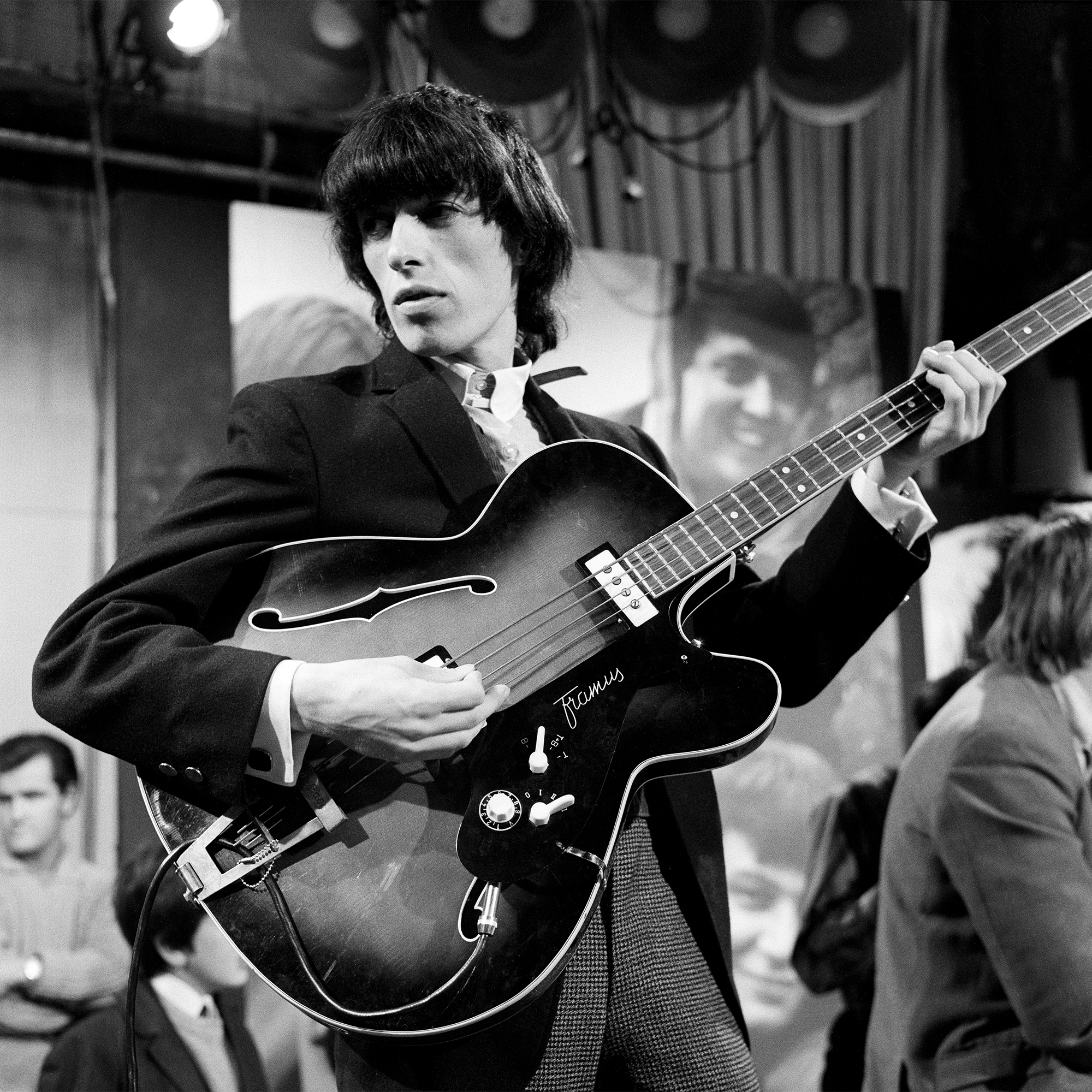 English bassist Bill Wyman of The Rolling Stones, during rehearsals for an episode of the Friday night TV pop/rock show 'Ready Steady Go!', at Associated-Rediffusion's Television House studios in London, 26th February 1965.