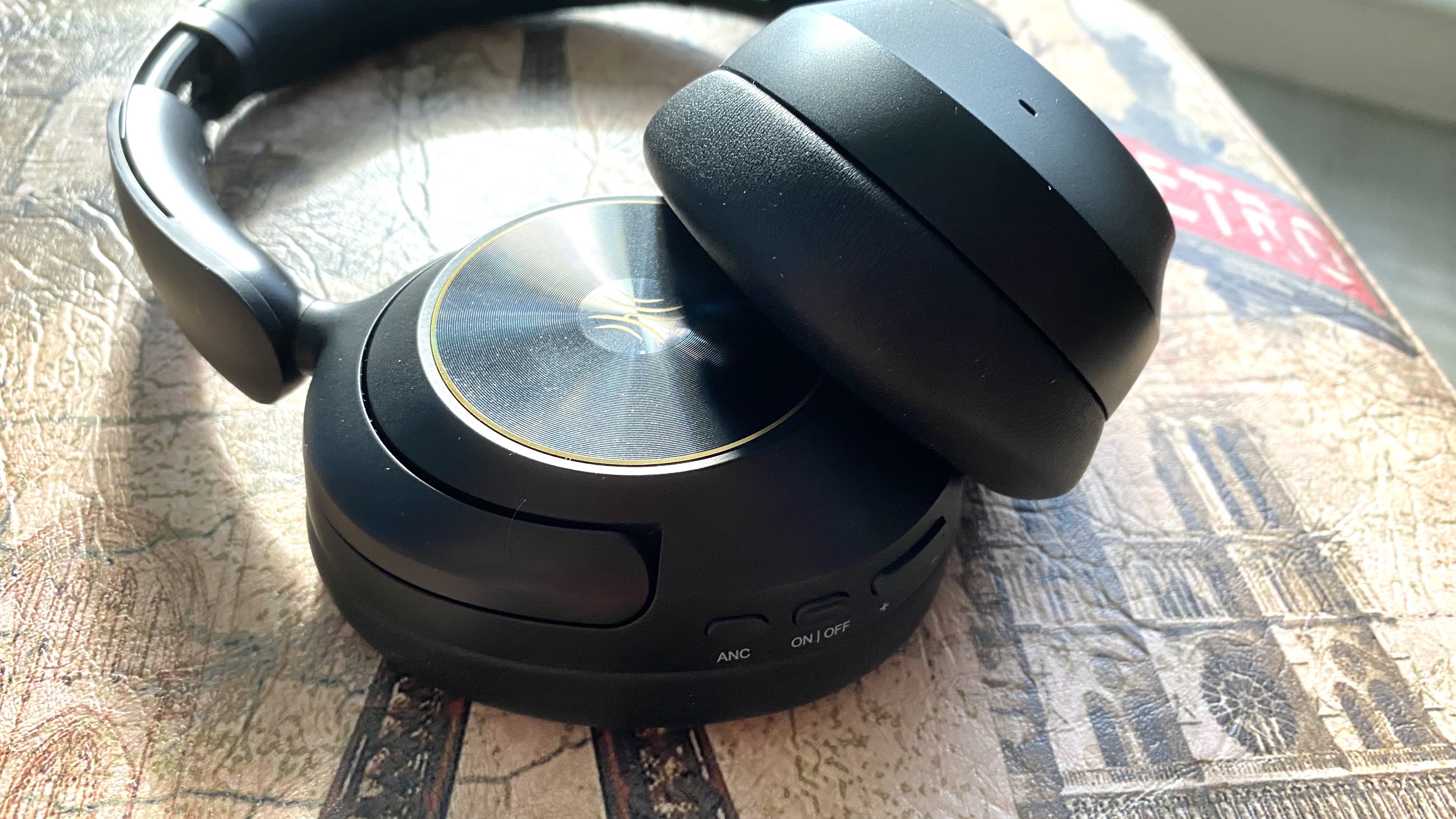 OneOdio Focus A 6 over-ear headphones on a Parisian stool