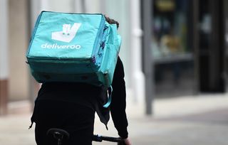 Deliveroo bike delivery rider as government promote free Uber Eats and Deliveroo for vaccine