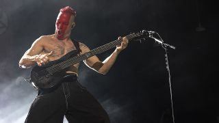 Bassist Ryan Martinie of Mudvayne performs at PNC Music Pavilion on July 23, 2023 in Charlotte, North Carolina.