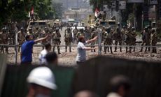 Supporters of ousted President Mohammed Morsi take cover
