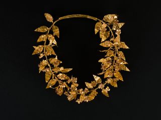 a gold necklace on display at the Brooklyn Museum