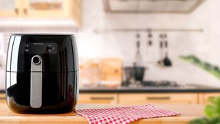 An air fryer sitting on the counter in a kitchen