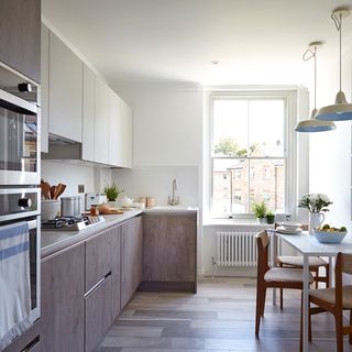 kitchen with grey kitchen cabinets and wooden flooring