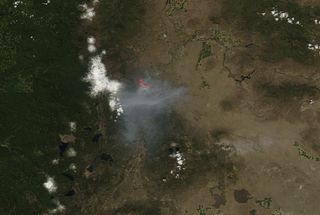 The Two Bulls fire as seen by the Moderate Resolution Imaging Spectroradiometer (MODIS) on NASA's Aqua satellite on June 8, 2014.