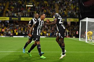 Ismaila Sarr of Watford celebrates with teammate Joao Pedro after scoring their team's first goal during the Sky Bet Championship between Watford and Middlesbrough at Vicarage Road on August 30, 2022 in Watford, England.