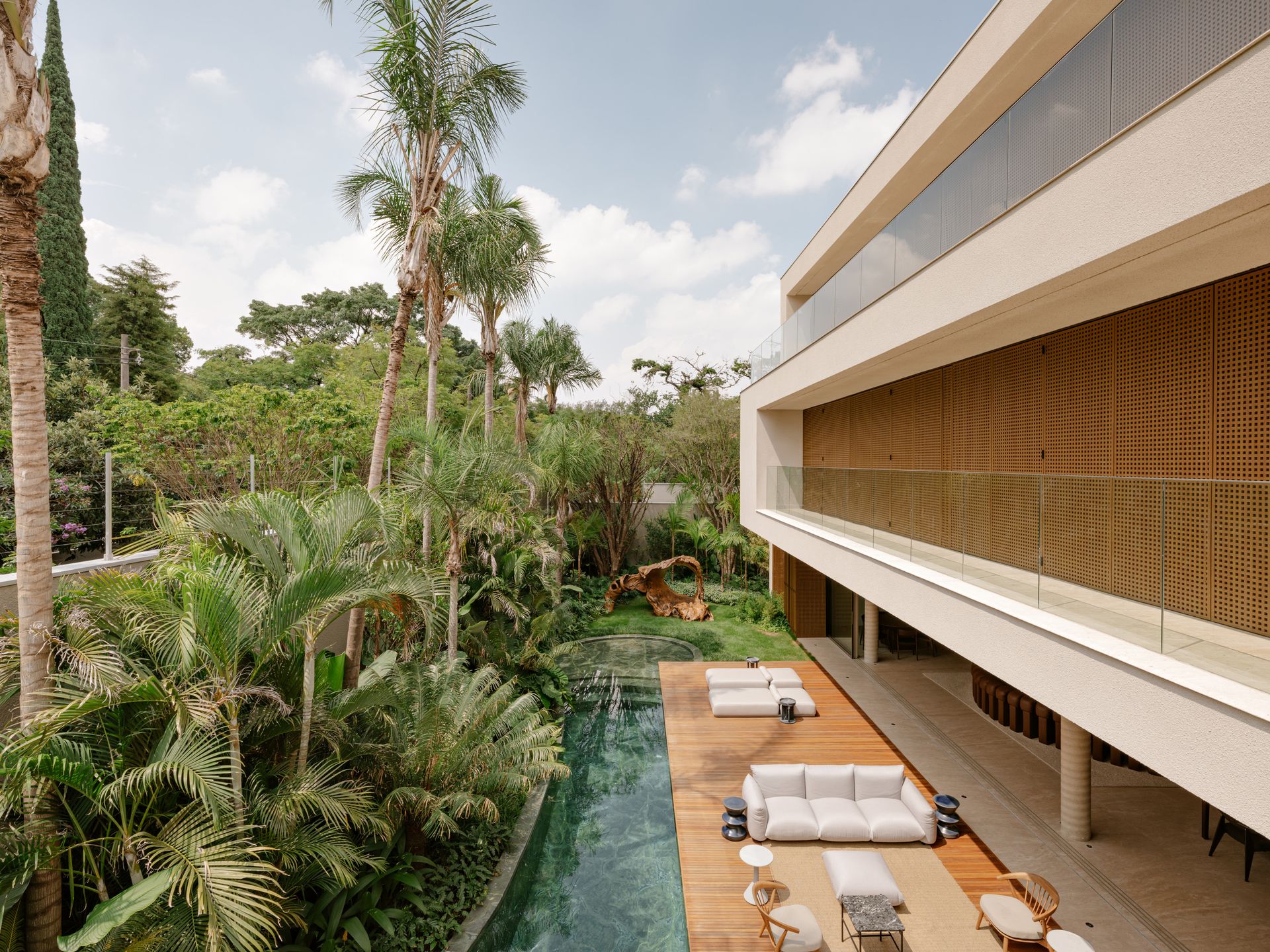house with pool, terrace and palm trees