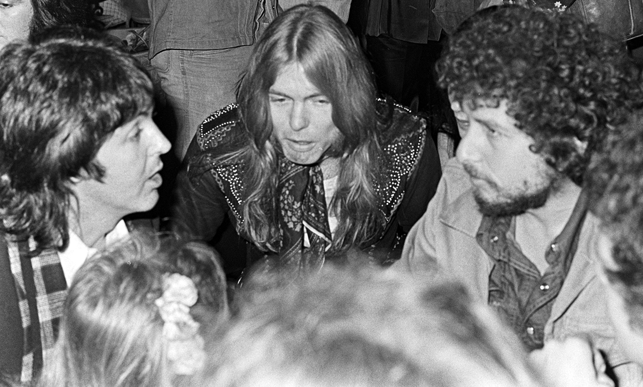 Paul McCartney, Gregg Allman and Bob Dylan attend a party, marking the conclusion of a North American tour by Faces, at the Greenhouse in Los Angeles on March 11, 1975.