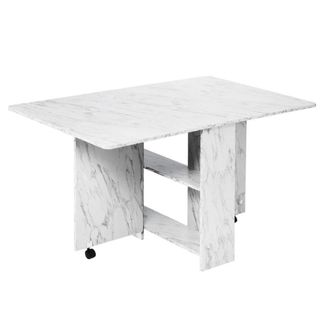 A white marble drop-leaf table with extra storage