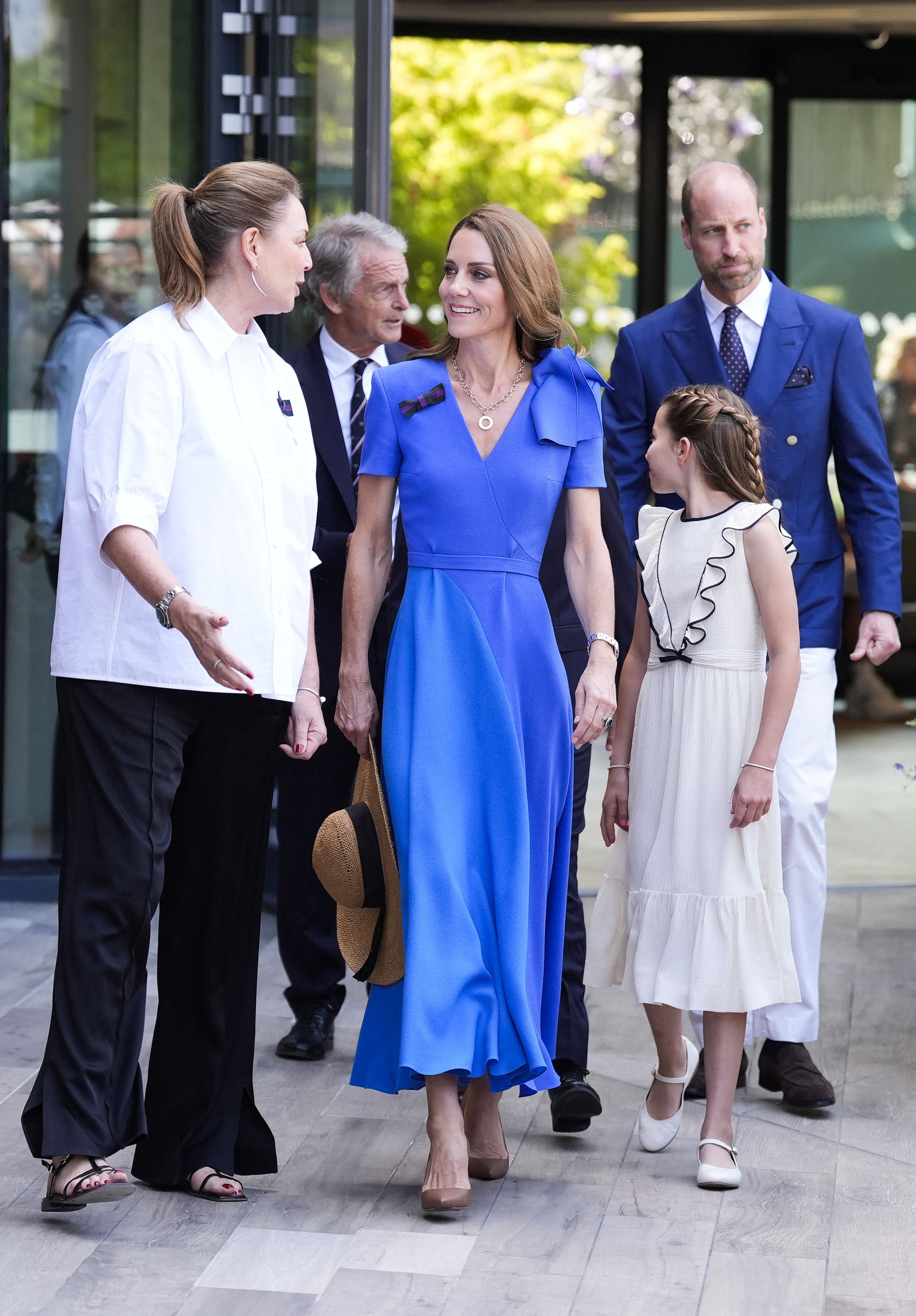 Kate Middleton wearing a blue dress with Ralph Lauren pumps at Wimbledon