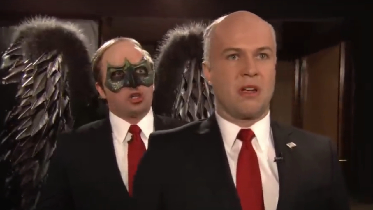 Beck Bennett as Birdman behind Taran Killam as Rudy Giuliani on SNL