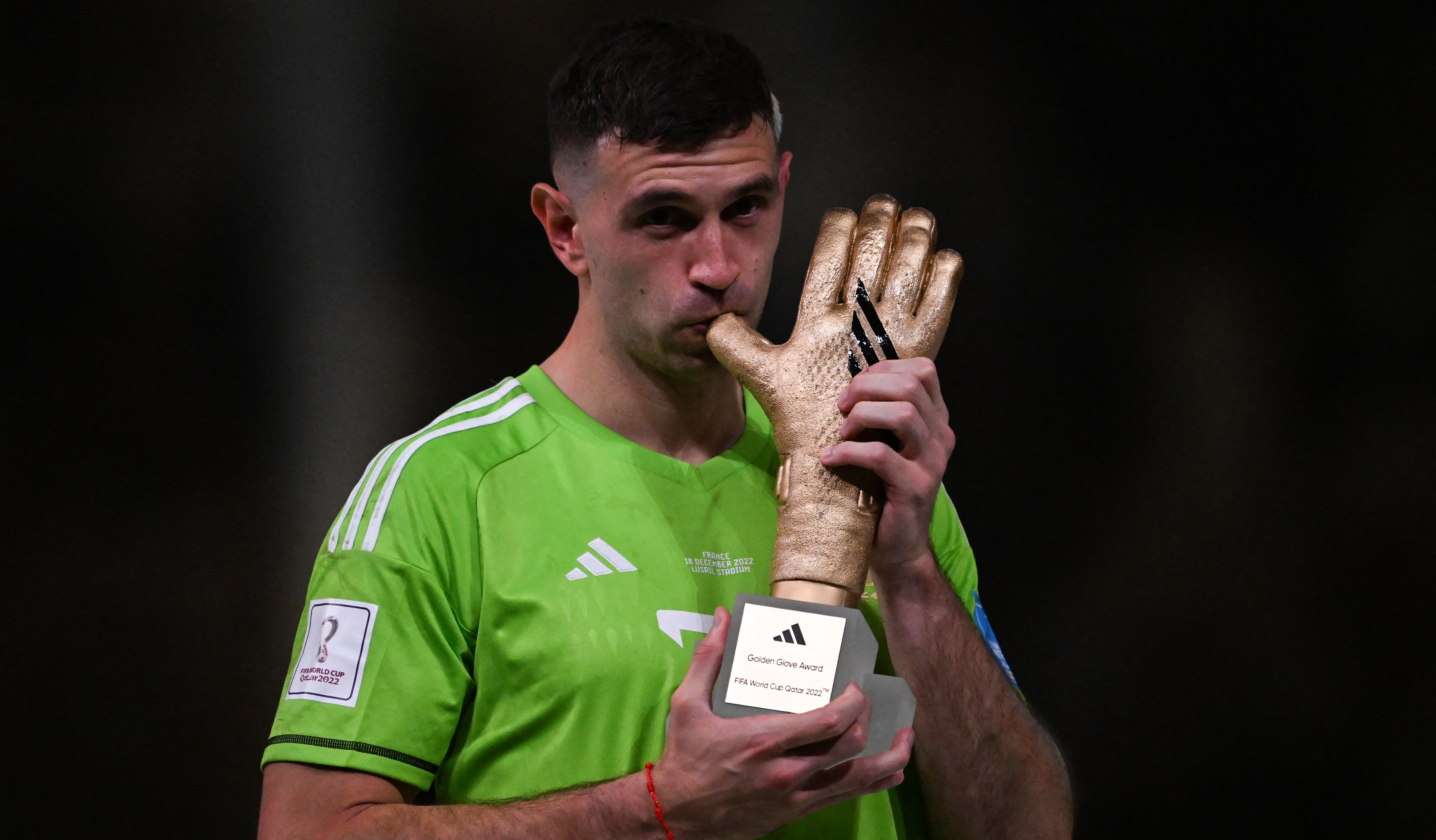 Emi Martinez poses with the FIFA Golden Glove award at the end of the Qatar 2022 World Cup final between Argentina and France at Lusail Stadium in Lusail, north of Doha on December 18, 2022